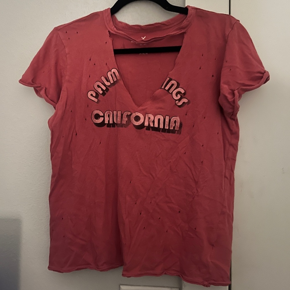 American eagle distressed pinkish red T-shirt with V neck cut out